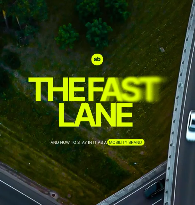 Key visual for a Springbok Agency mobility-themed blog post, showing a topview of crossing highways and a title in yellow centered in the middle saying 'The Fast Lane, and how to stay in it as a mobility brand'. 